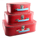 red paper suitcases